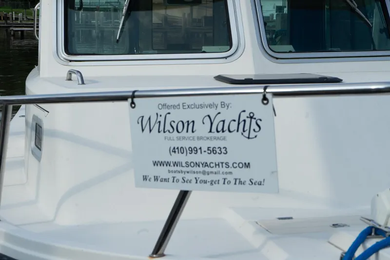 Slide: The Image of 2005 Parker 2520 Deep Vee Sport Cabin with Wilson Yachts brokerage sign. - 38