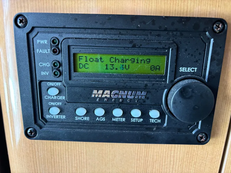 Slide: The Image of Control panel of a 2004 Maxum 2900 SCR boat, displaying "Float Charging" at 13.1V. - 10
