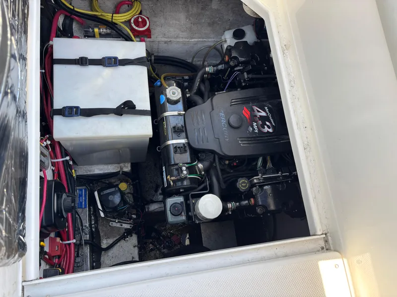 Slide: The Image of Engine compartment of a 2004 Maxum 2900 SCR boat, showing detailed mechanical components. - 22