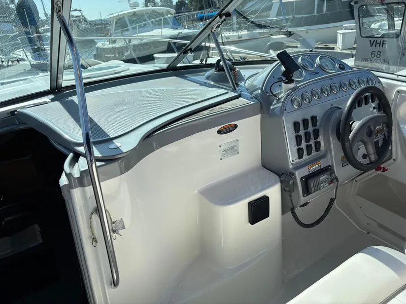 Slide: The Image of 2004 Maxum 2900 SCR boat cockpit with steering wheel and control panel. - 5