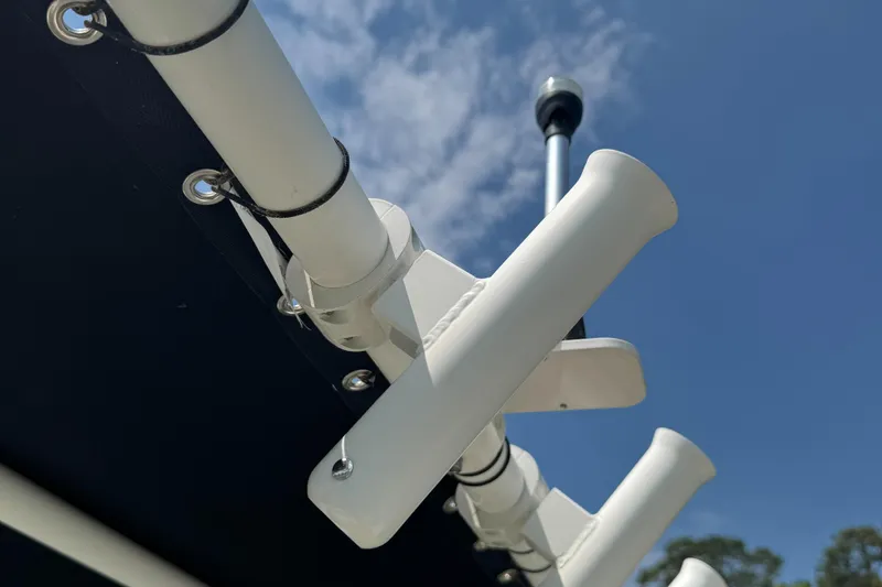 Slide: The Image of Rod holders on a 2021 Carolina Skiff 21 LS against a clear blue sky. - 11