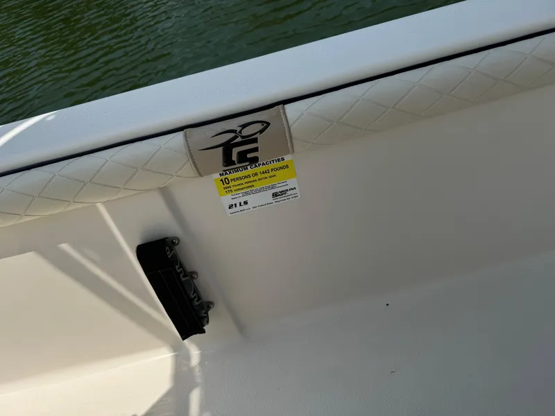 Slide: The Image of 2021 Carolina Skiff 21 LS interior detail with safety label and logo. - 3