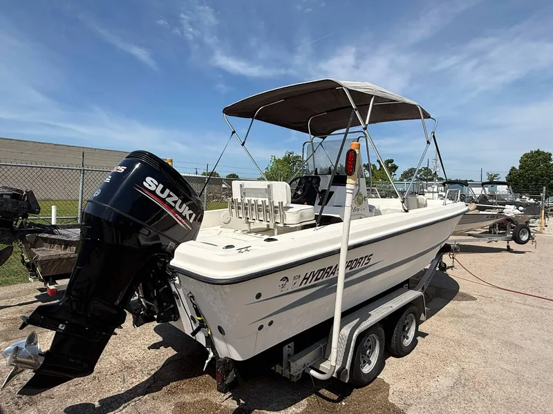 Slide: The Image of 1999 Hydra-Sports 22 Bay Sport boat with Suzuki outboard motor on trailer. - 3