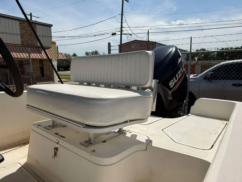 Slide: The Image of 1999 Hydra-Sports 22 Bay Sport boat interior with seating and Suzuki outboard motor. - 4
