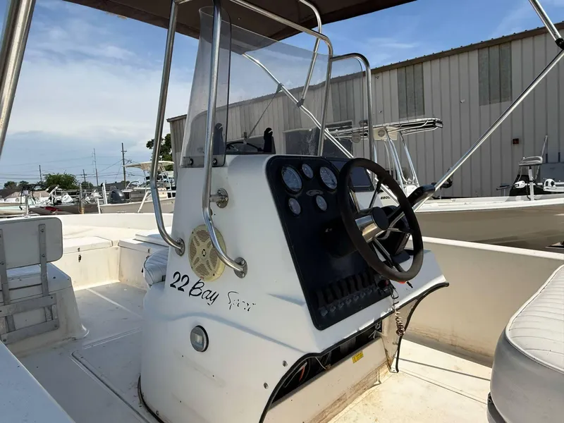 Slide: The Image of 1999 Hydra-Sports 22 Bay Sport boat interior with steering console and gauges. - 7