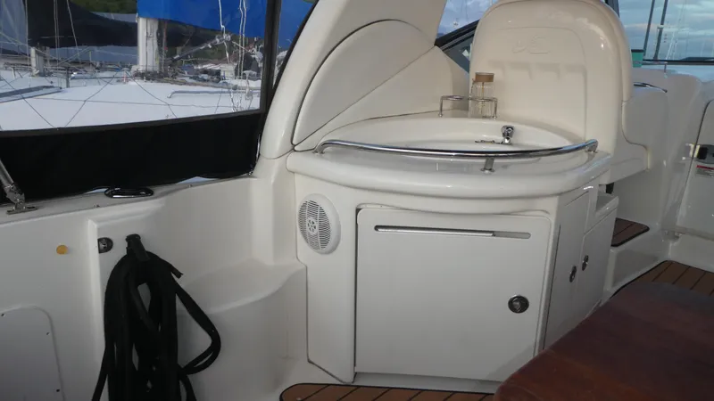 Slide: The Image of 2007 Sea Ray 340 Sundancer boat interior with sink and storage area. - 10