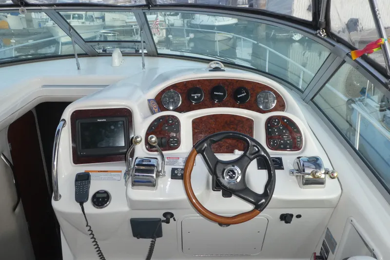Slide: The Image of Cockpit of 2007 Sea Ray 340 Sundancer with steering wheel and navigation instruments. - 15