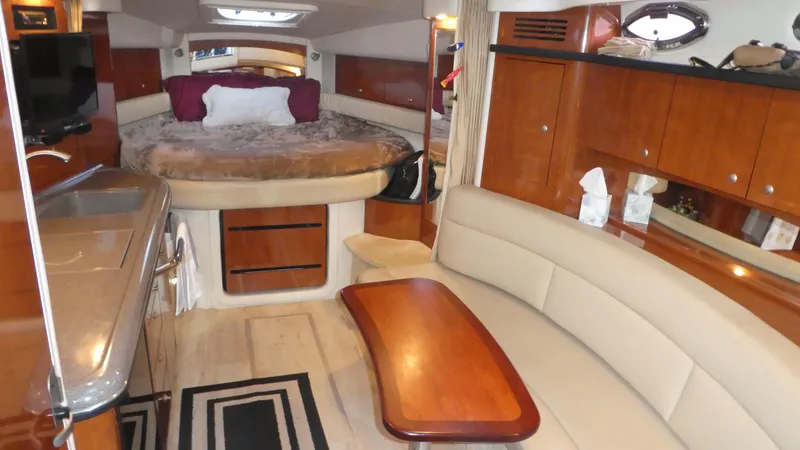 Slide: The Image of Interior of 2007 Sea Ray 340 Sundancer yacht with cozy seating and elegant wood finishes. - 16