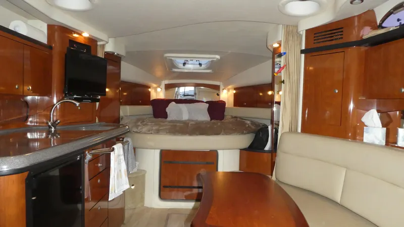 Slide: The Image of Interior of 2007 Sea Ray 340 Sundancer yacht with cozy seating and modern amenities. - 18