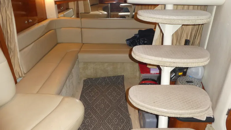 Slide: The Image of Interior of 2007 Sea Ray 340 Sundancer with beige seating and spiral staircase. - 24
