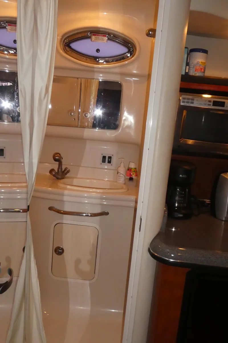 Slide: The Image of 2007 Sea Ray 340 Sundancer interior with kitchenette and bathroom sink. - 29