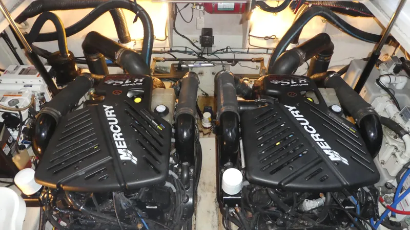 Slide: The Image of Twin Mercury engines in a 2007 Sea Ray 340 Sundancer boat engine room. - 31