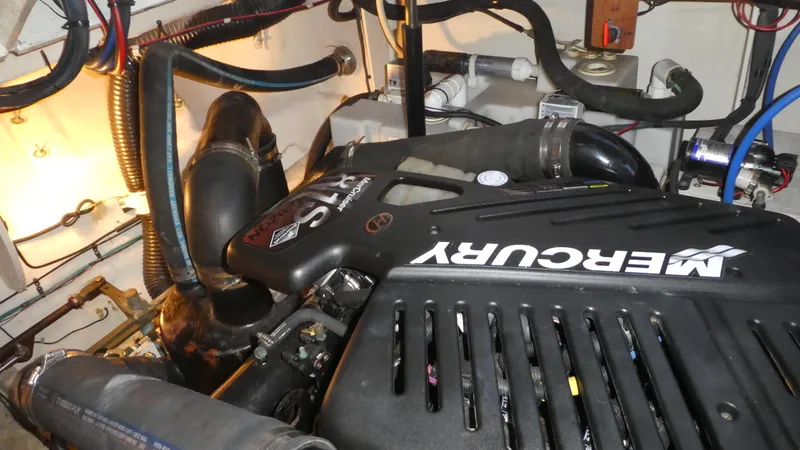 Slide: The Image of Engine compartment of a 2007 Sea Ray 340 Sundancer with a Mercury engine. - 33