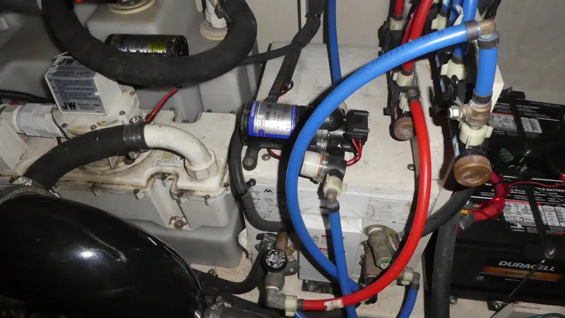 Slide: The Image of Engine compartment of a 2007 Sea Ray 340 Sundancer with visible wiring and components. - 34