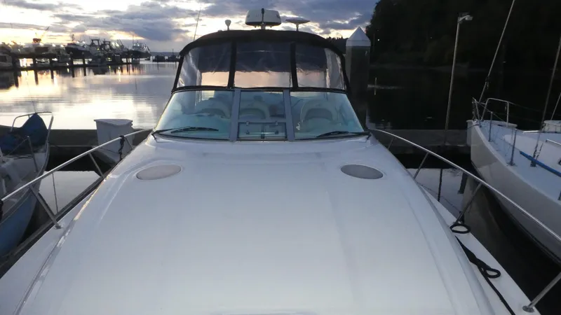 Slide: The Image of 2007 Sea Ray 340 Sundancer yacht docked at sunset, front view. - 39