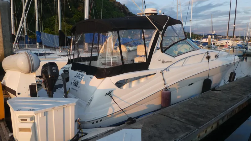 Slide: The Image of 2007 Sea Ray 340 Sundancer docked at marina, featuring sleek design and black canopy. - 5