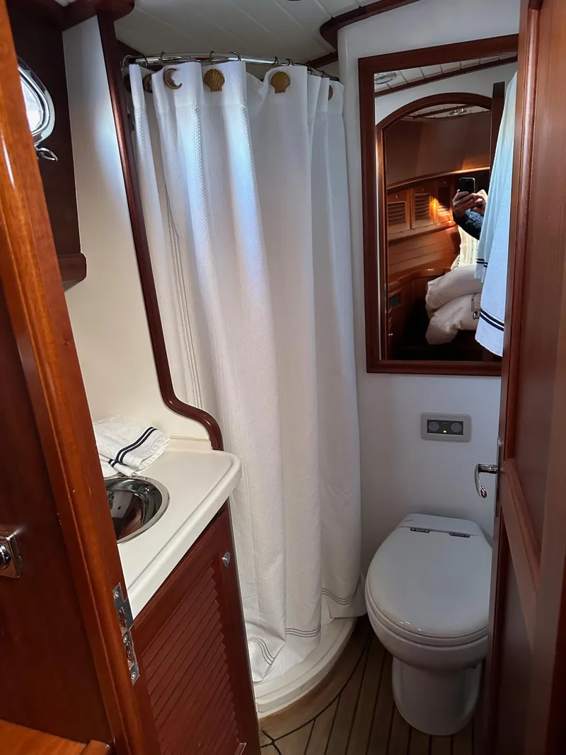Slide: The Image of 2003 Vicem 51 Classic yacht bathroom with shower, sink, and toilet. - 13