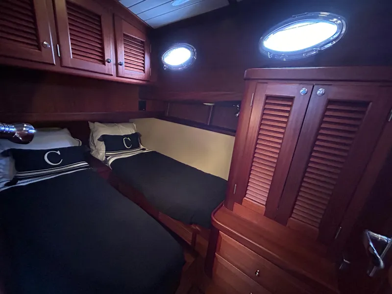 Slide: The Image of Luxurious cabin interior of 2003 Vicem 51 Classic yacht with twin beds and wooden cabinetry. - 14