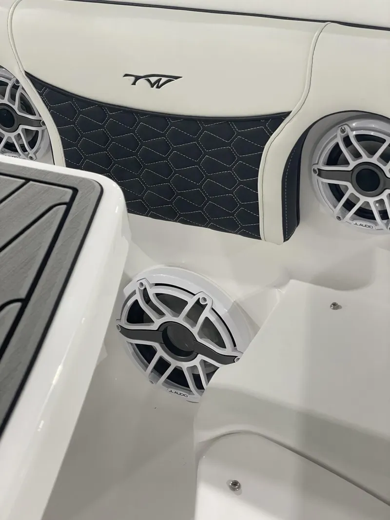 Slide: The Image of 2025 Tidewater 272 boat interior with speakers and stylish upholstery design. - 4
