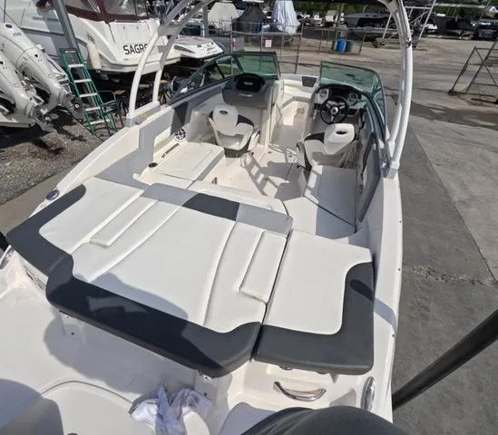 Slide: The Image of 2022 Chaparral 23 SSi OB boat, spacious interior, excellent condition, docked outdoors. - 10