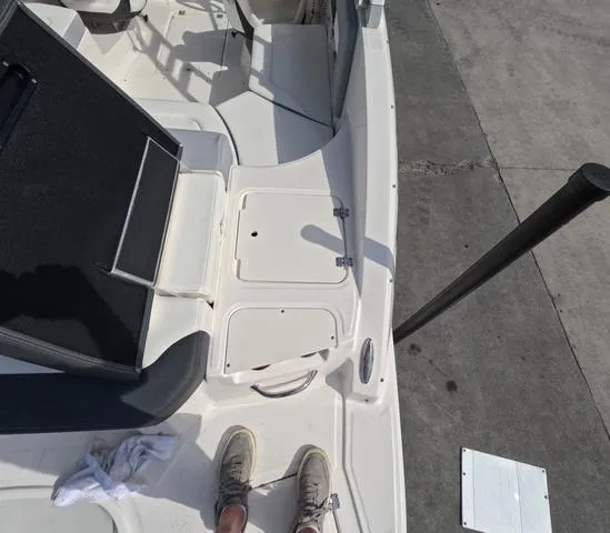 Slide: The Image of 2022 Chaparral 23 SSi OB boat interior, great condition, white deck, clean and spacious layout. - 11