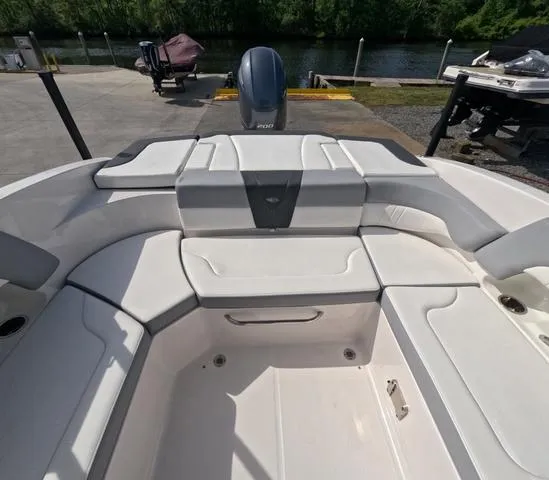 Slide: The Image of 2022 Chaparral 23 SSi OB boat interior, showcasing spacious seating and sleek design. - 12