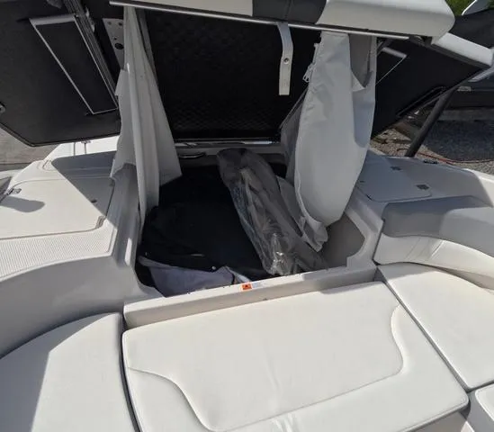 Slide: The Image of 2022 Chaparral 23 SSi OB boat storage compartment, open and spacious, in great condition. - 13