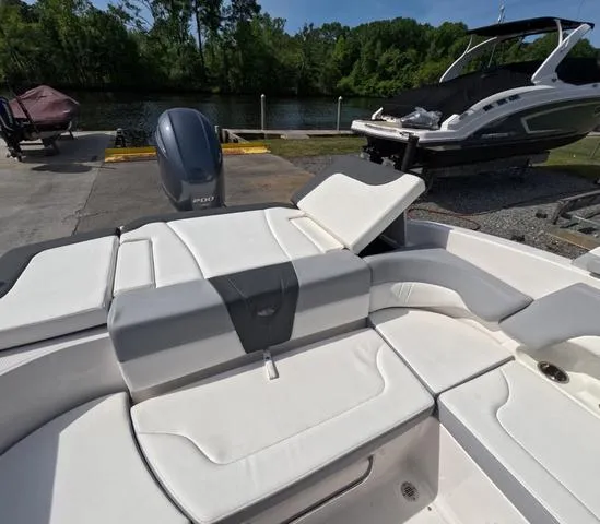 Slide: The Image of 2022 Chaparral 23 SSi OB boat in great condition, featuring spacious seating and sleek design. - 14