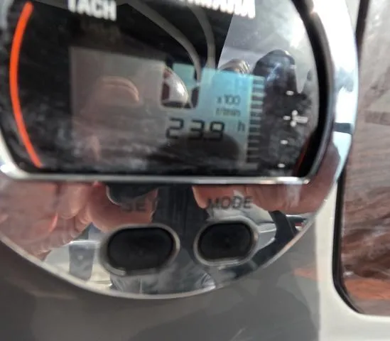 Slide: The Image of Close-up of a Chaparral 23 SSi OB tachometer displaying 239 hours. - 18