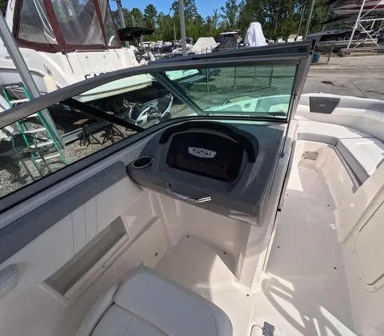 Slide: The Image of 2022 Chaparral 23 SSi OB boat interior, great condition, spacious seating, and modern dashboard. - 20