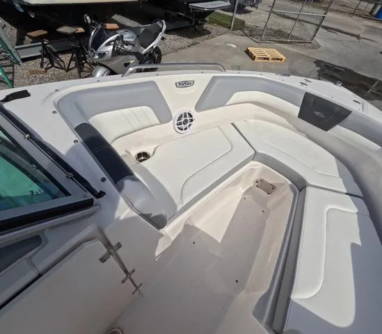 Slide: The Image of 2022 Chaparral 23 SSi OB boat interior, featuring spacious seating in excellent condition. - 25
