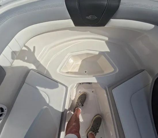Slide: The Image of Interior view of 2022 Chaparral 23 SSi OB boat, showcasing seating and flooring. - 29