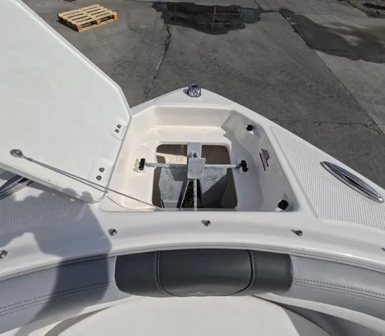 Slide: The Image of 2022 Chaparral 23 SSi OB boat anchor compartment, open lid, great condition. - 30