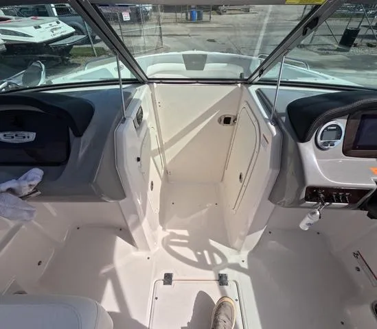 Slide: The Image of 2022 Chaparral 23 SSi OB boat interior, showcasing helm and seating area in great condition. - 33