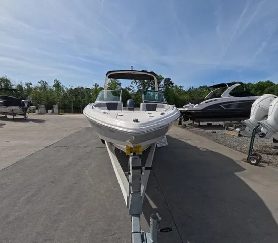 Slide: The Image of 2022 Chaparral 23 SSi OB boat in great condition on trailer, outdoor setting. - 5