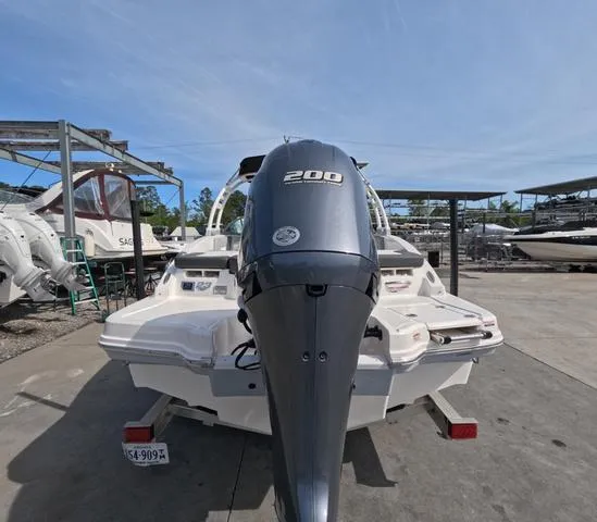 Slide: The Image of 2022 Chaparral 23 SSi OB boat in excellent condition, rear view with outboard motor. - 8