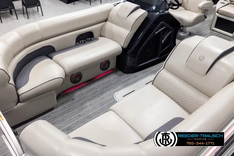 Slide: The Image of 2022 Premier 230 Solaris RL boat interior with beige seating and modern design. - 10