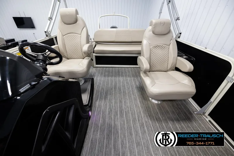 Slide: The Image of 2022 Premier 230 Solaris RL interior with plush seating and modern design. - 14