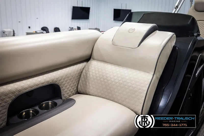 Slide: The Image of Luxurious seating in 2022 Premier 230 Solaris RL boat with beige upholstery and cup holders. - 19