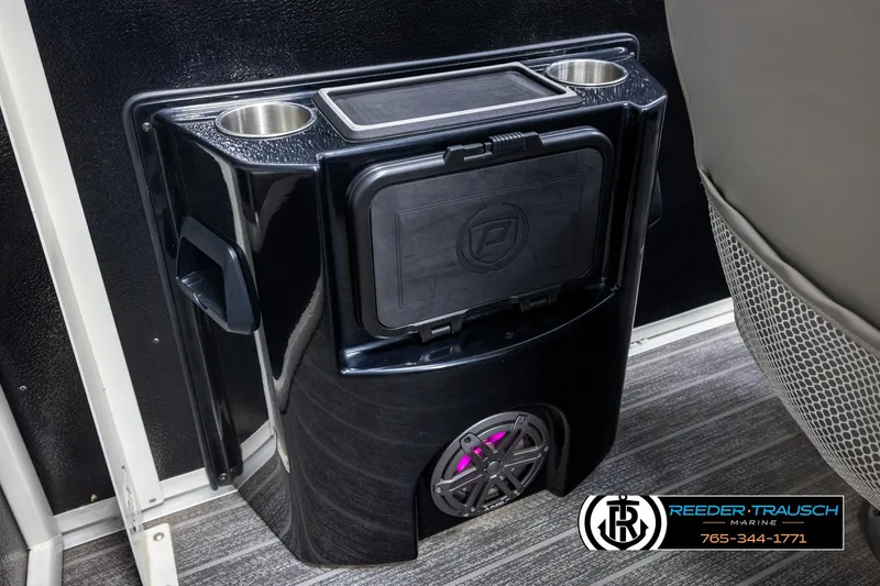 Slide: The Image of 2022 Premier 230 Solaris RL boat console with cup holders and speaker. - 29
