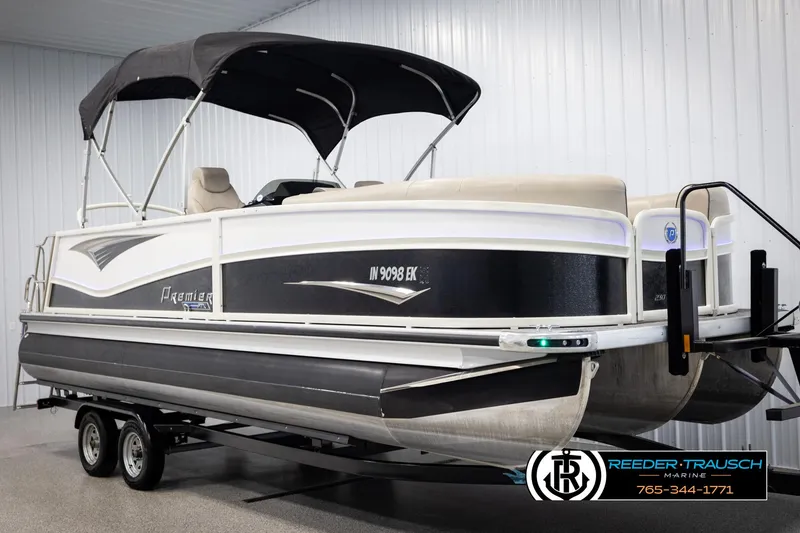 Slide: The Image of 2022 Premier 230 Solaris RL pontoon boat on trailer in indoor showroom. - 3