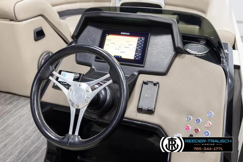 Slide: The Image of Steering console of 2022 Premier 230 Solaris RL boat with navigation display. - 31