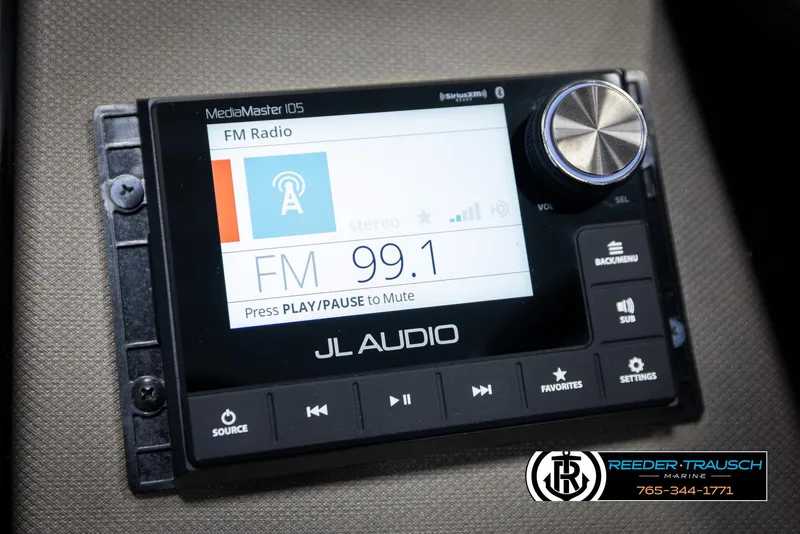 Slide: The Image of FM radio display on JL Audio system in 2022 Premier 230 Solaris RL. - 34