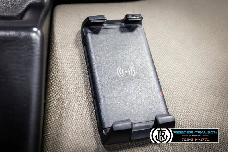 Slide: The Image of Wireless charging pad in 2022 Premier 230 Solaris RL boat interior. - 36