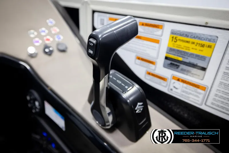 Slide: The Image of Throttle control of 2022 Premier 230 Solaris RL boat with capacity labels. - 39