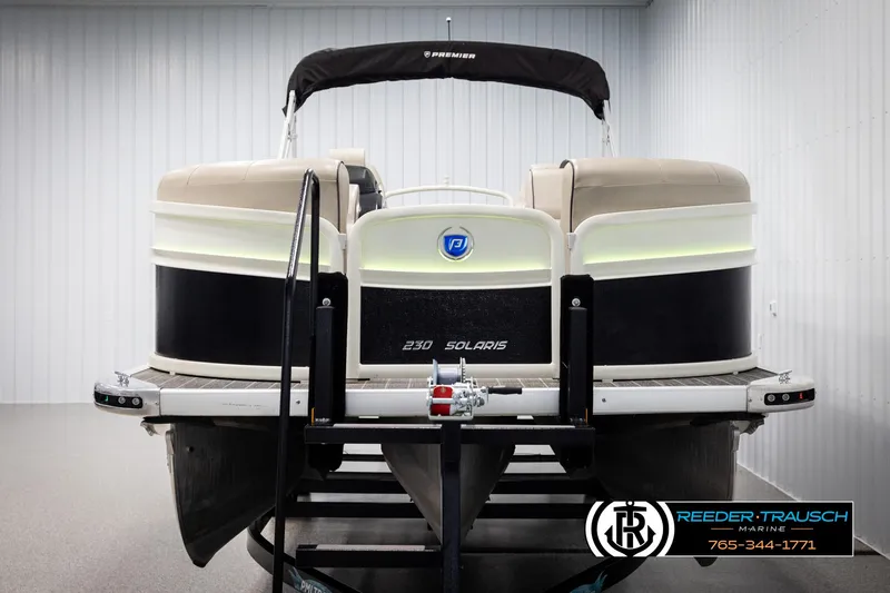 Slide: The Image of 2022 Premier 230 Solaris RL pontoon boat in showroom, front view. - 8