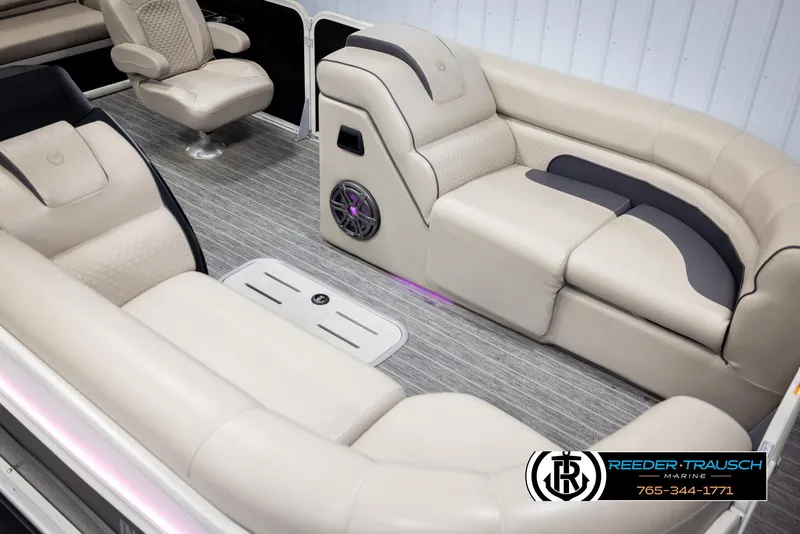Slide: The Image of 2022 Premier 230 Solaris RL boat interior with beige seating and modern design. - 9