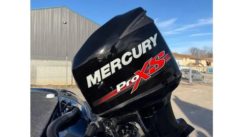 Slide: The Image of Mercury Pro XS outboard motor on a 2014 Nitro Z-8 boat, outdoor setting. - 13