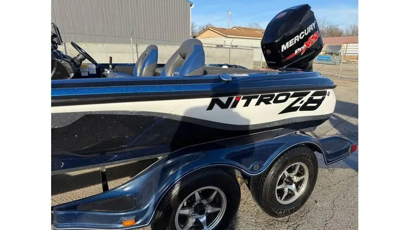 Slide: The Image of 2014 Nitro Z-8 boat with Mercury engine on a trailer. - 14