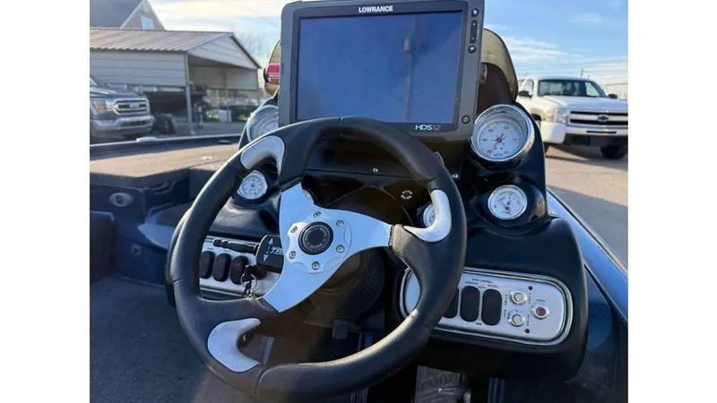 Slide: The Image of Steering wheel and dashboard of 2014 Nitro Z-8 boat with navigation display. - 5